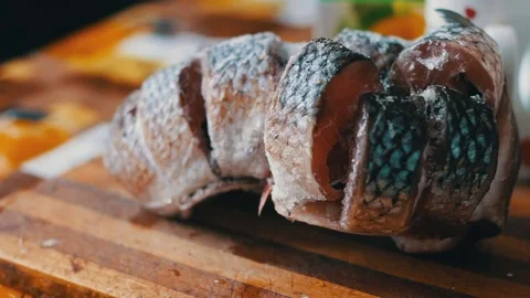 Frozen pieces of fish in home kitchen Stock Footage