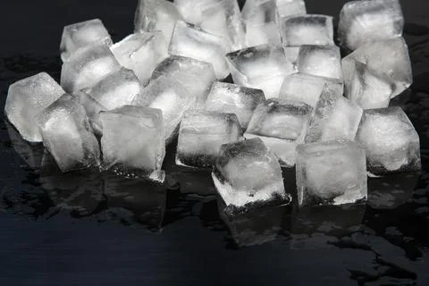 Frozen pieces of ice on a dark background Stock Photos
