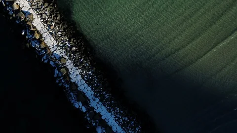 Frozen pier reaching out into the arctic Lofoten ocean Video stock 124337212