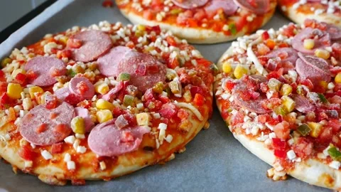 Frozen pizza in a baking tray, ready pizza, frozen foods, Stock Footage 166749178