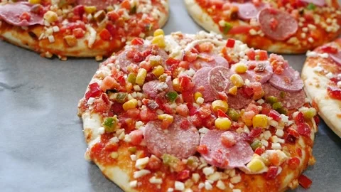 Frozen pizza in a baking tray, ready pizza, frozen foods, Stock Footage 166749194