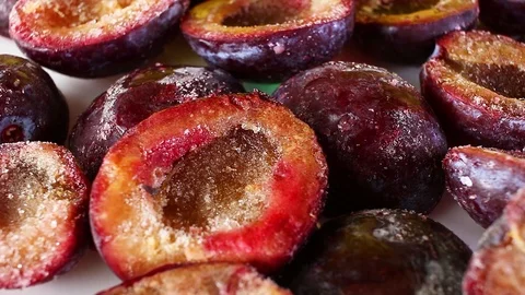 Frozen plum half plums seamless looping background closeup video Stock Footage 101350090