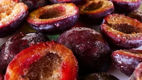 Frozen plum half plums seamless looping background closeup video Stock Footage 101350295