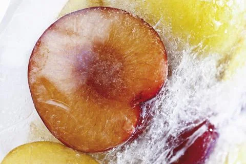 Frozen plums Stock Photos