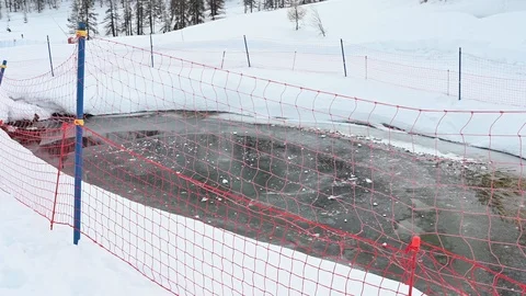 Frozen pond in a ski slope Stock Footage 126668822