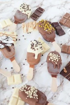 Frozen popsicles with chocolate Stock Photos