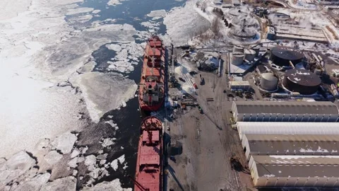 Frozen port logistics with cargo ship and cranes aerial Stock Footage 329452425