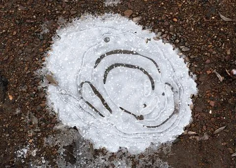 Frozen puddle close up Stock Photos