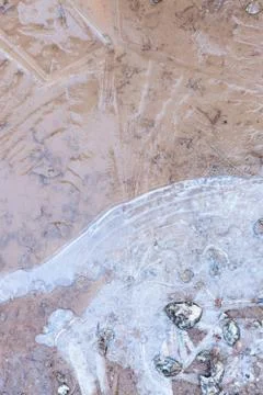 Frozen puddle close-up texture Stock Photos