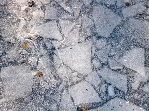 Frozen puddle in the sun Stock Photos
