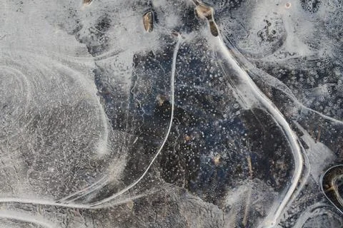 Frozen puddle. Texture, thin ice. Ice surface. Thin ice.The first thin crust Stock Photos