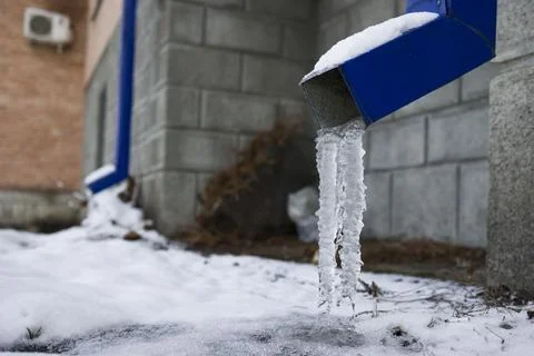 Frozen Rain Water Draining Gutter Downpipe Stock Photos