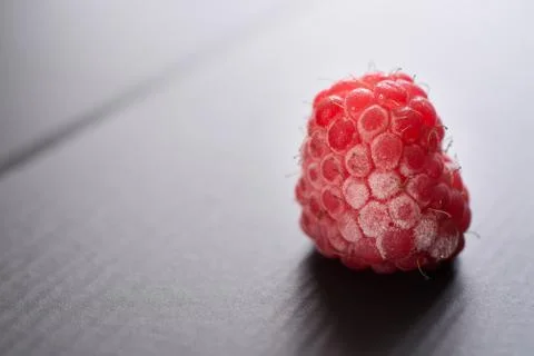 Frozen raspberry closeup. Stock Photos