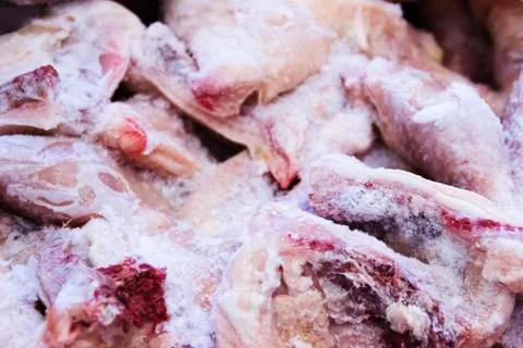 Frozen raw chicken, background macro view from above Stock Photos
