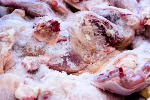 Frozen raw chicken, background macro view from above Stock Photos