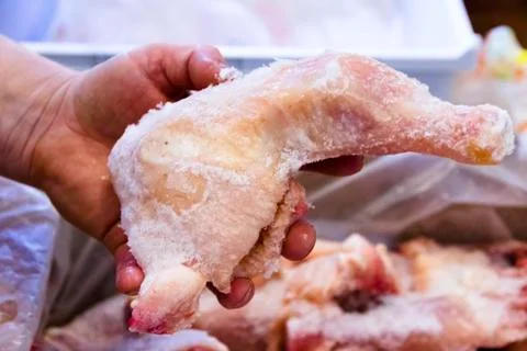 Frozen raw chicken, background macro view from above Stock Photos