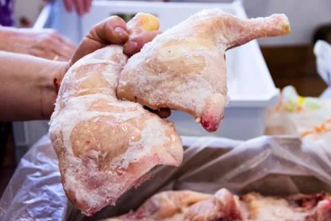 Frozen raw chicken, background macro view from above Stock Photos