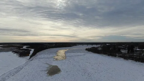 Frozen Red River under Stunning Sky Stock Footage 122322355