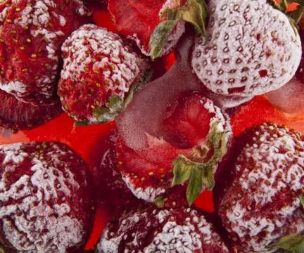 Frozen red strawberry as background view from above Stock Photos