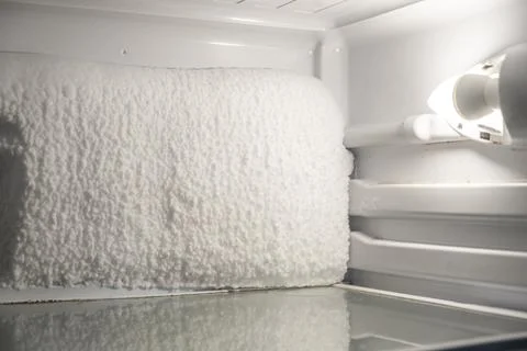 Frozen refrigerator that needs to be defrosted. Stock Photos