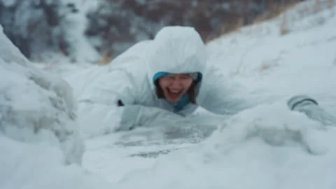 Frozen researcher fights for grip. Cold environment endangers lone scientist at Stock Footage 346470211