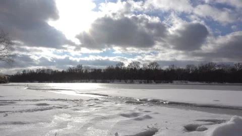 Frozen river and clouds in time laps. Stock Footage 166162658