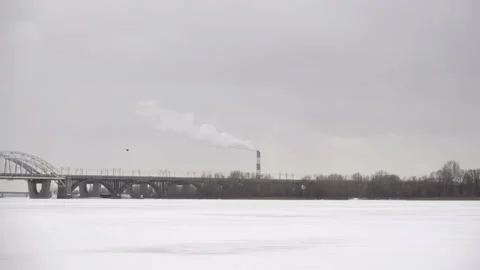 Frozen river and a helicopter flying in slow motion. Stock Footage 166161902