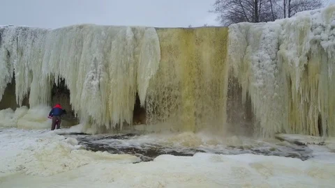 Frozen river and iced waterfall aerial Stockbeeldmateriaal 72633503