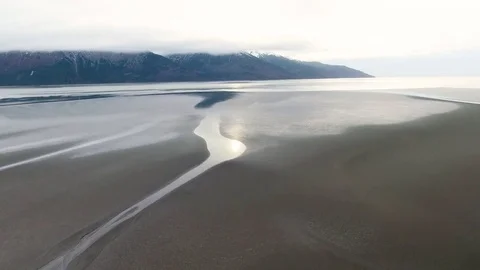 Frozen river and snow covered mountain ranges Stock-Footage 79723550