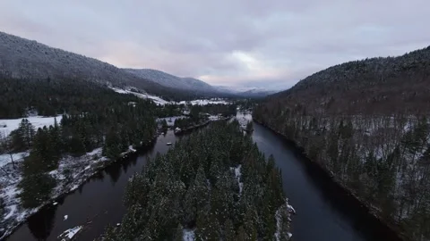 Frozen river bend in snowy mountains Stock Footage 321179223