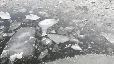 Frozen River with Breaking Ice Floes - Winter Water Landscape Stock Footage 329108439