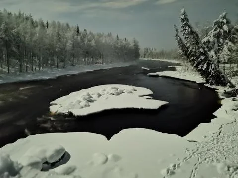 Frozen river at dusk Stock Photos