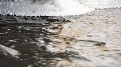 Frozen River Flow with Icicle Stock Footage 33547854