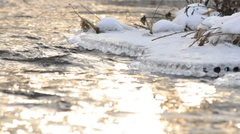 Frozen River Flow with Icicle Stock Footage 33547924