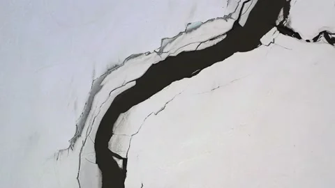 Frozen river flow in snowy winter Stock Footage 166897194