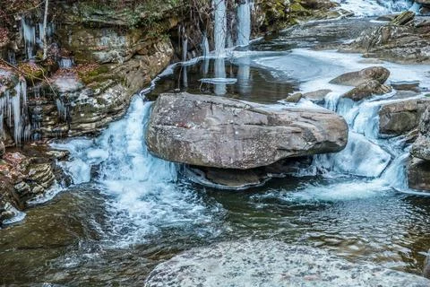 Frozen river flowing downstream Stock Photos
