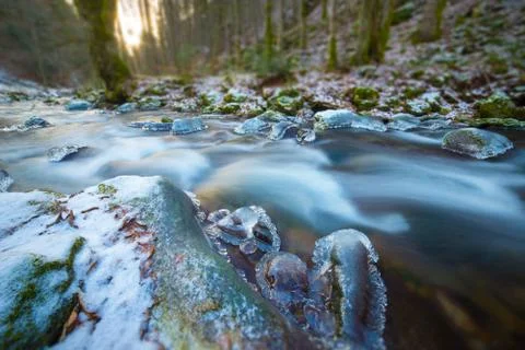 Frozen river in the forest - tilt shift Stock Photos
