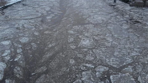 Frozen river full of ice floes in the Netherlands. Aerial view of Winter scenery Vídeos de archivo 148815540