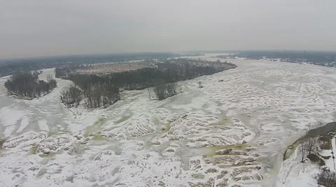 Frozen river high aerial view ascending overlooking island Stock Footage 49748522