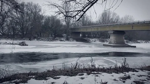 Frozen river, ice, bridge, extreme cold winter Stock Footage 72237007