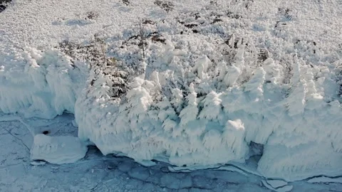 Frozen River With ice Cliffs and trees. Cinematic Drone View Of Icy Llake With Stock-Footage 339204110