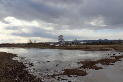 Frozen river landscape in springtime Stock Photos
