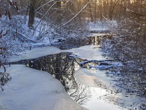Frozen river in the magic winter forest 스톡 사진
