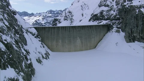 Frozen river in the snow-capped mountain ranges, Over Dam And Through The Gorge Stock Footage 108600827