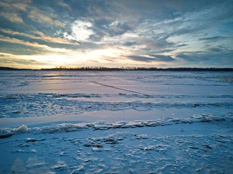 The frozen river at sunset Stock Photos