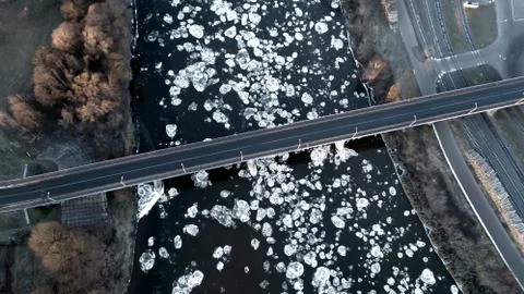 Frozen river top view. River bridge. Aerial survey of the drone Stock Photos