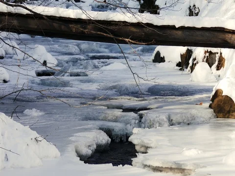 Frozen River under a Bridge Stock Footage 73548759