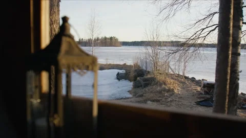 Frozen river view inside barbecue hut Lapland, Finland in winter time Stock Footage 325677981