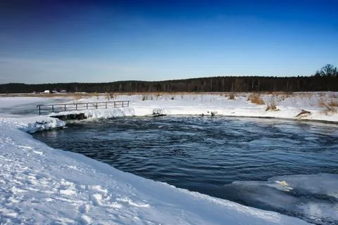 Frozen river in winter Stock Photos