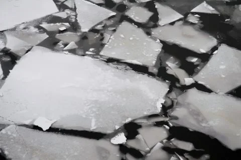 Frozen river in winter, white graphic abstract snow texture, black distressed Stock Photos